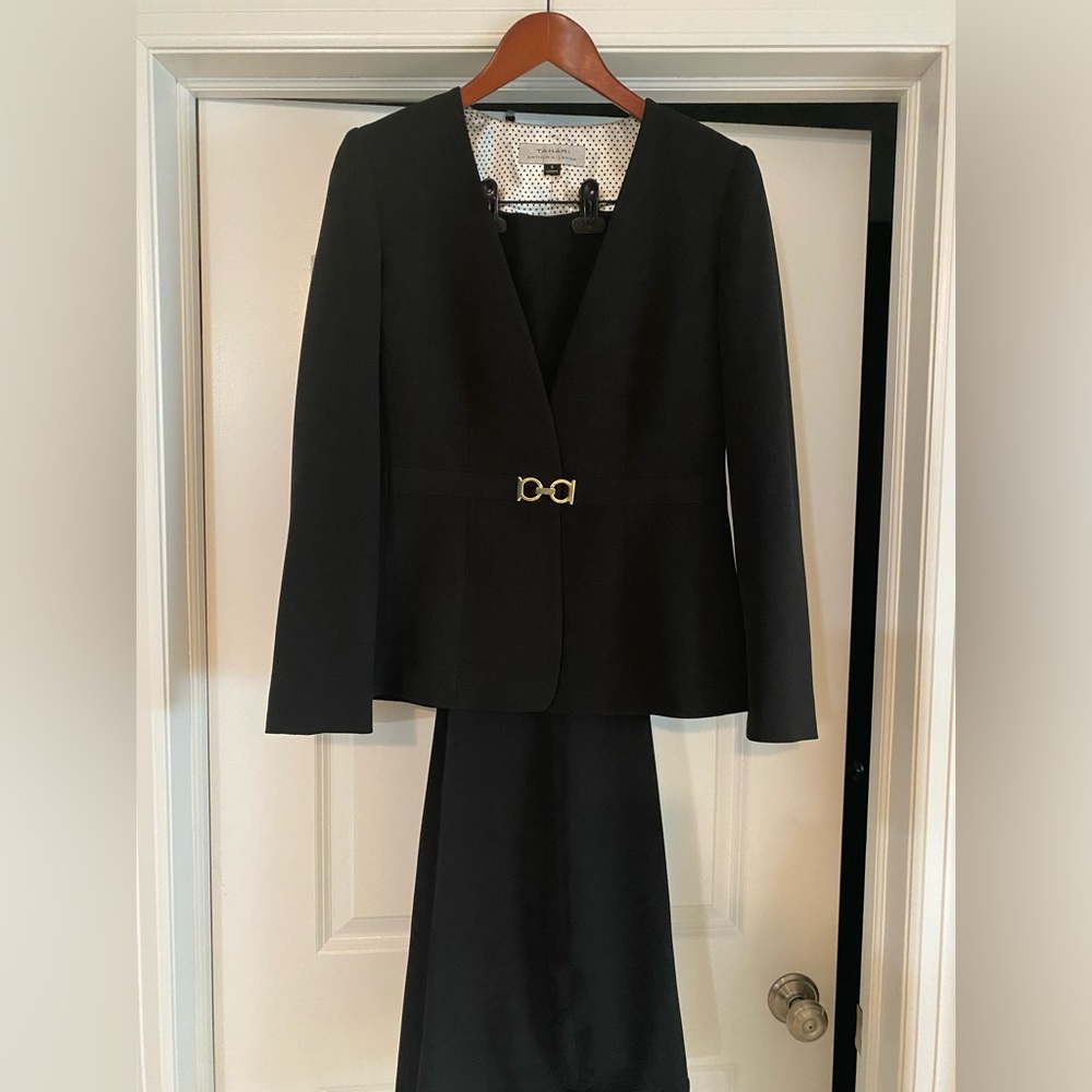 Black pants suit with gold detail.